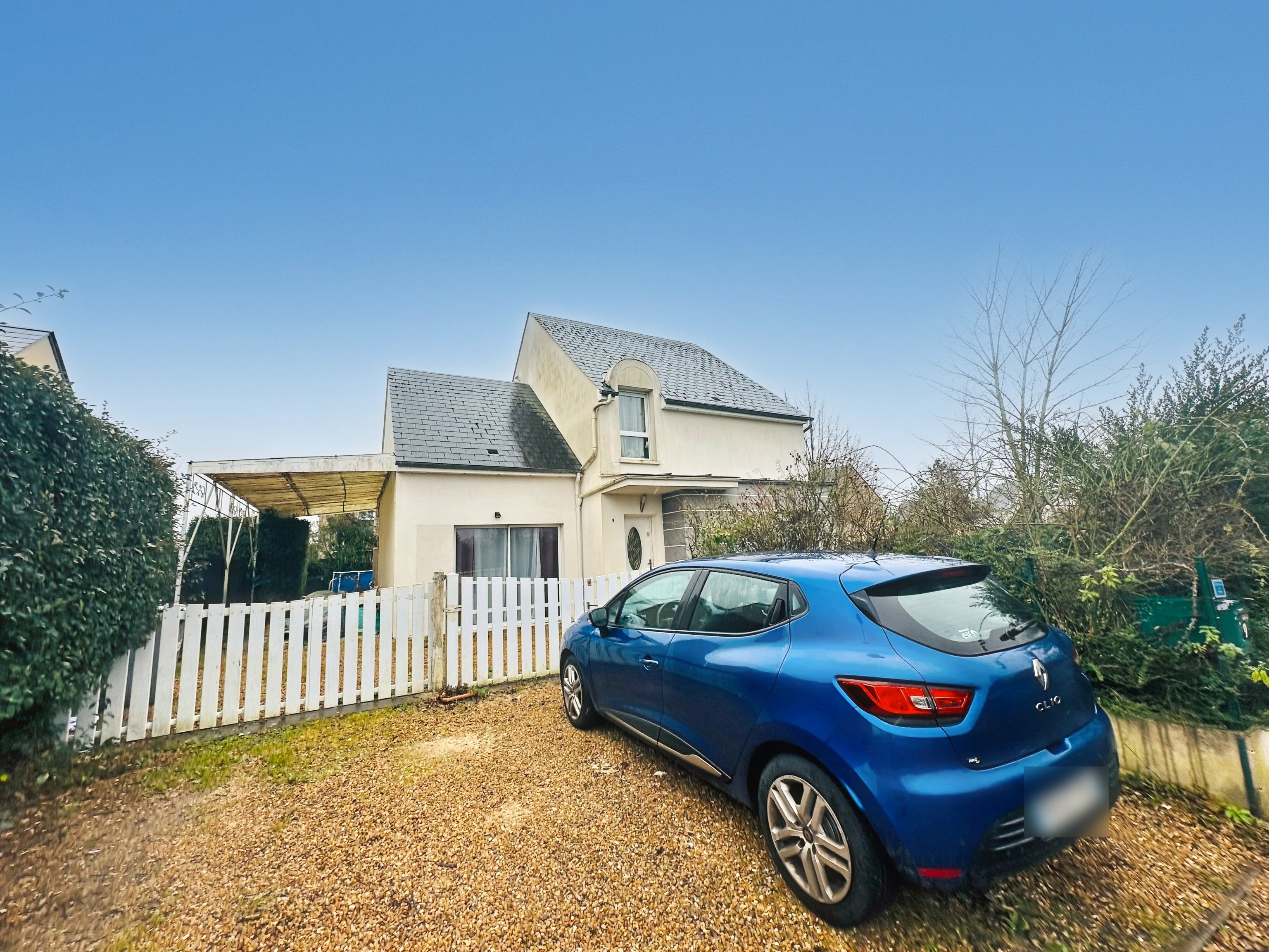 Exterior enhancement before/after with blue sky and blurred license plate
